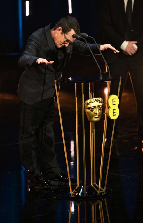 Michael J Fox presents the Best Film Award on stage during the EE BAFTA Film Awards at The Royal Festival Hall in London, England, on February 18, 2024. | Source: Getty Images