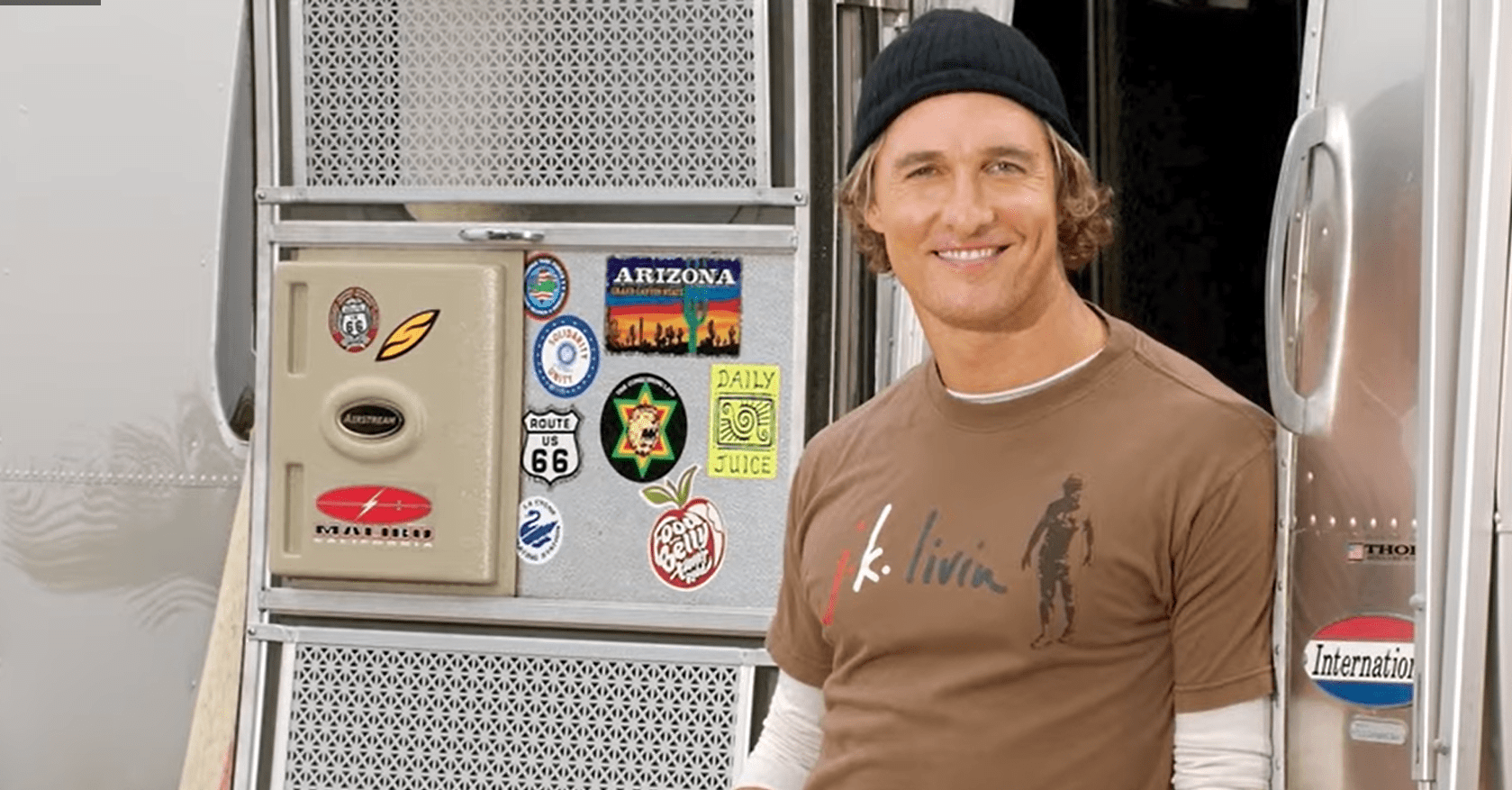 Matthew McConaughey standing in the doorway of an Airstream trailer | Source: YouTube/Famous Entertainment