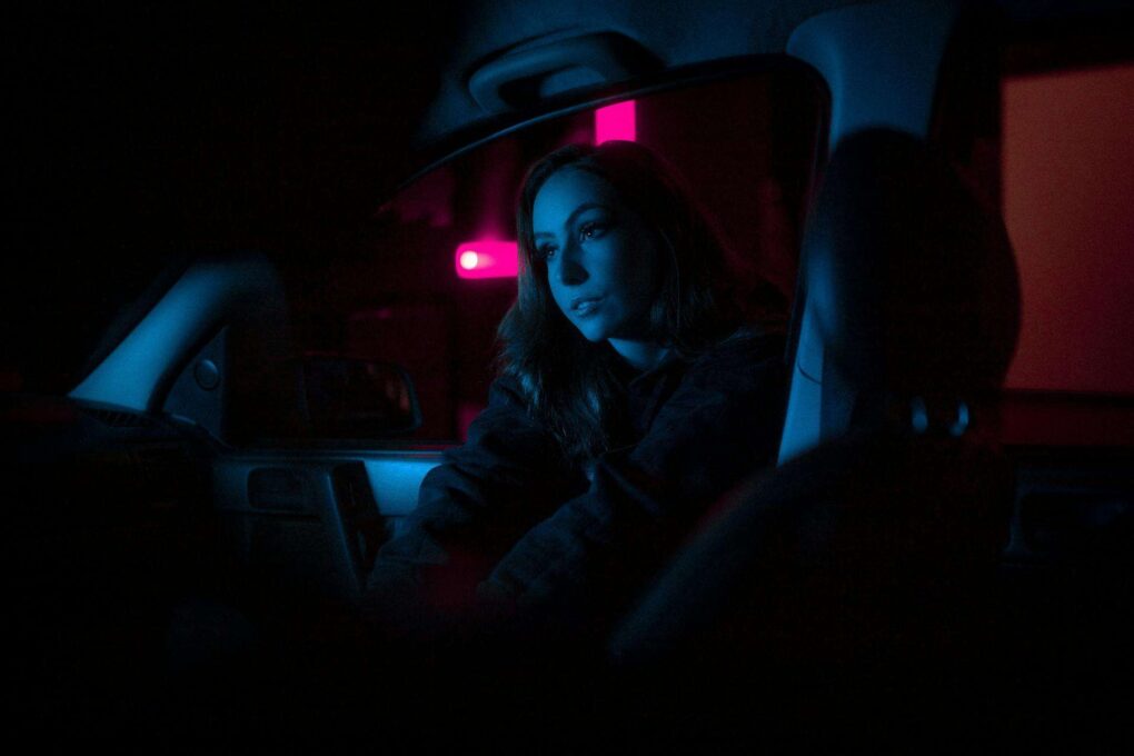 A woman sitting in a car | Source: Pexels