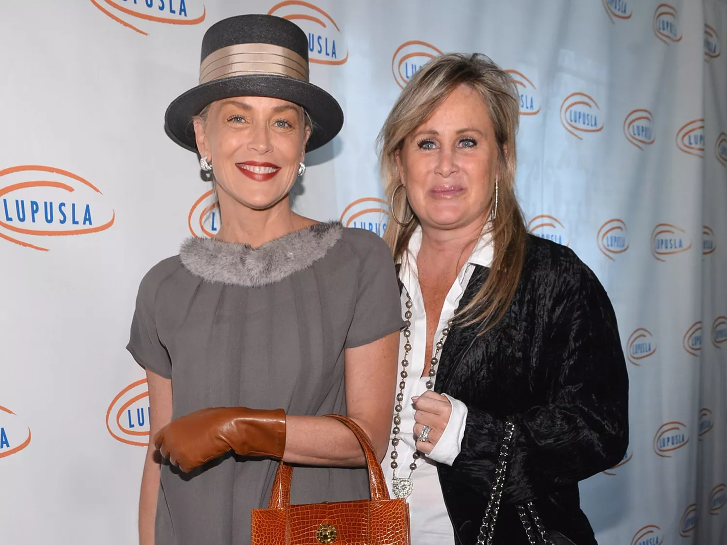 Sharon Stone and sister Kelly Stone arrive to the Lupus LA 10th Anniversary Hollywood Bag Ladies Luncheon on November 1, 2012. 