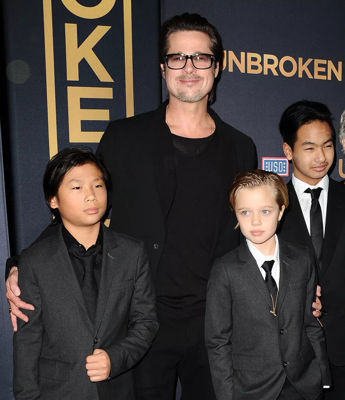 Pax Jolie-Pitt, Brad Pitt, Shiloh Jolie-Pitt and Maddox Jolie-Pitt at the premiere of "Unbroken," 2014 | Source: Getty Images