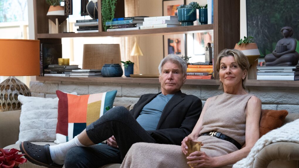 Harrison Ford and Wendie Malick sitting on a couch.
